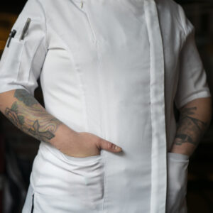 Model wearing YellowJacket Chefwear White Womens Chef Jacket Uniform with Front Pockets